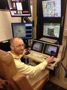 "Unblinking Eye" playwright Justin Taylor at a simulator cockpit on Holloman Air Force Base in New Mexico.