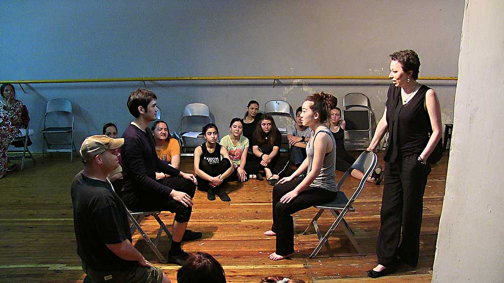 John Abramson (left) leads a workshop with students and Ilkhom company members, including (left to right, on chairs) Rustam Mamedov and Natalya Lee. At right, standing, is Irina Bharat. (Photo by Gavin Reub)