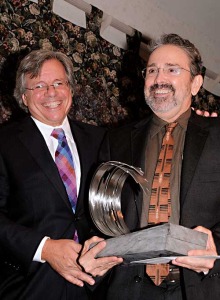 Craig Lucas, right, accepts the Greenfield Prize from Bruce E. Rogers. (Courtesy of Hermitage Artist Retreat)