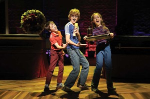 From left, Noah Hinsdale, Griffin Birney and Sydney Lucas in Fun Home at the Public Theater. (Photo by Joan Marcus)