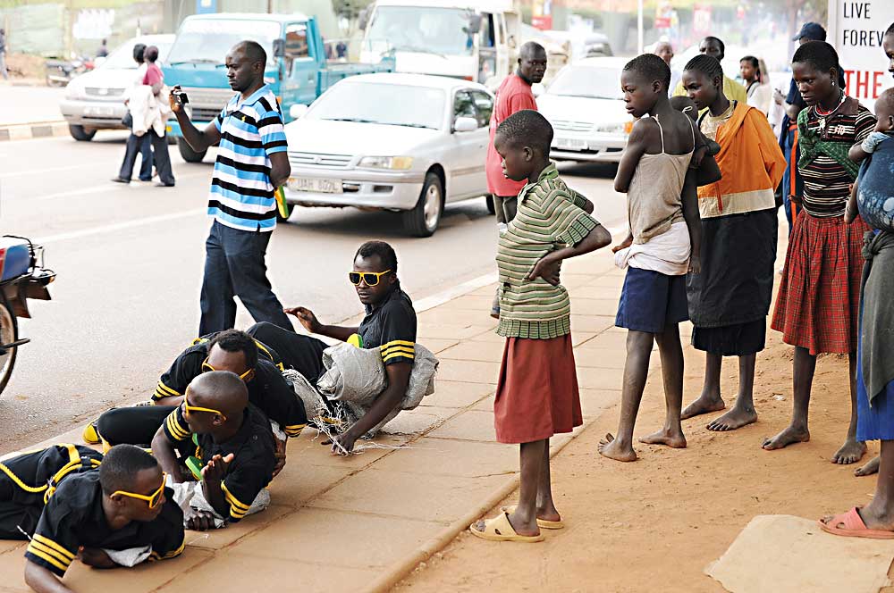 Artists in Uganda do a street performance called Unmasking the Street. (Photo by Abdul Kinyenya Muyingo)