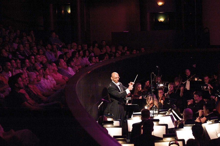 Jay Dias conducts the Lyric Stage orchestra.