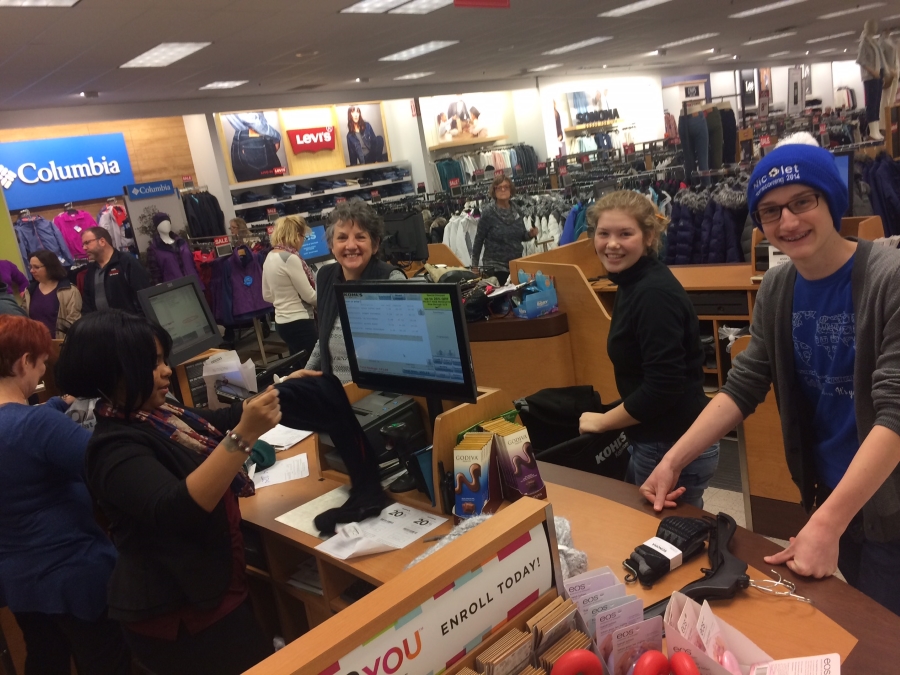 Milwaukee Rep staff and Teen Council members shopping for A Christmas Carol Families Program.