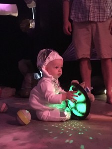 An audience member at "Babies in Space" at the Alliance Theatre.