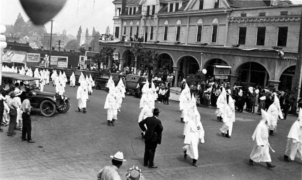 A Ku Klux Klan march on the corner of Main and Pioneer in Ashland, Ore. in the 1920s.