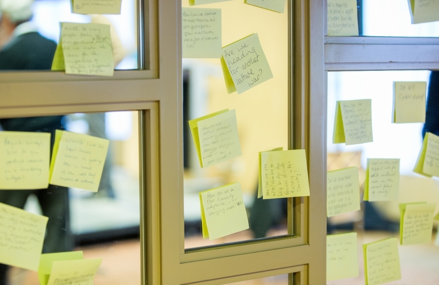 Forumgoers wrote action items on post-its. (Photo by Isaiah Tanenbaum)
