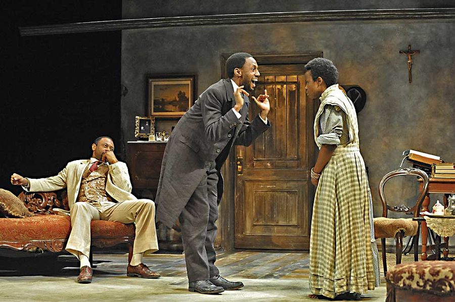From left, Alvin Keith (Chancellor), Irungu Mutu (Chilford) and Nancy Moricette (Ester) in the 2013 Woolly Mammoth Theatre Company staging, directed by Michael John Garcés. (Photo by Stan Barouh)