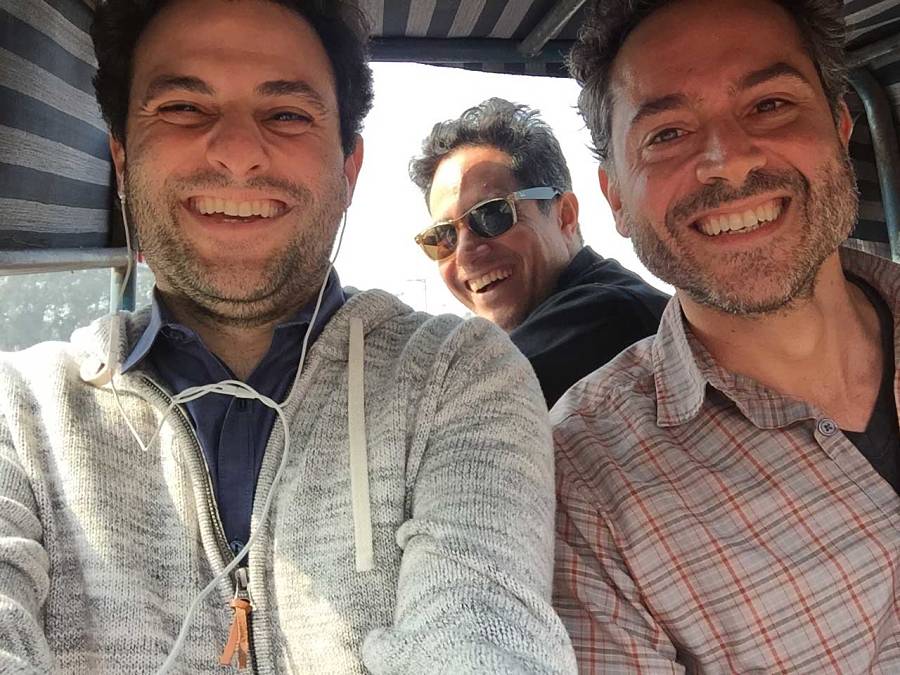 Moayed, Joseph and Metwally take a selfie in a rickshaw.