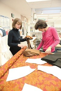 Costume designer Susan Tsu's assistant Mary Scott (in black) works with draper Catherine Stump on 'Romeo and Juliet.' (Photo by Jenny Graham)