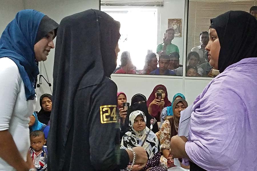 Members of the new Rohingya Women's Theatre perform a scene about worker abuse for Rohingya refugees as part of their show titled "Know Your Options". The series of scenes illustrate common problems that refugees face along with options for their resolution. Rohingya Women's Development Network in Kuala Lumpur, Malaysia
