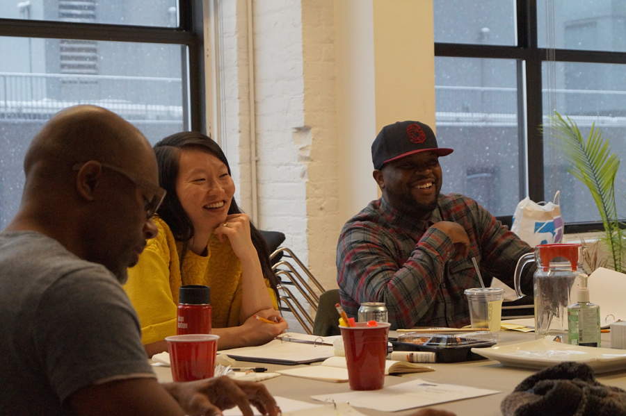 Performer Jahi Kearse, director Jenny Koons, and playwright Idris Goodwin at a table read at the Lark Play Development Center in New York.