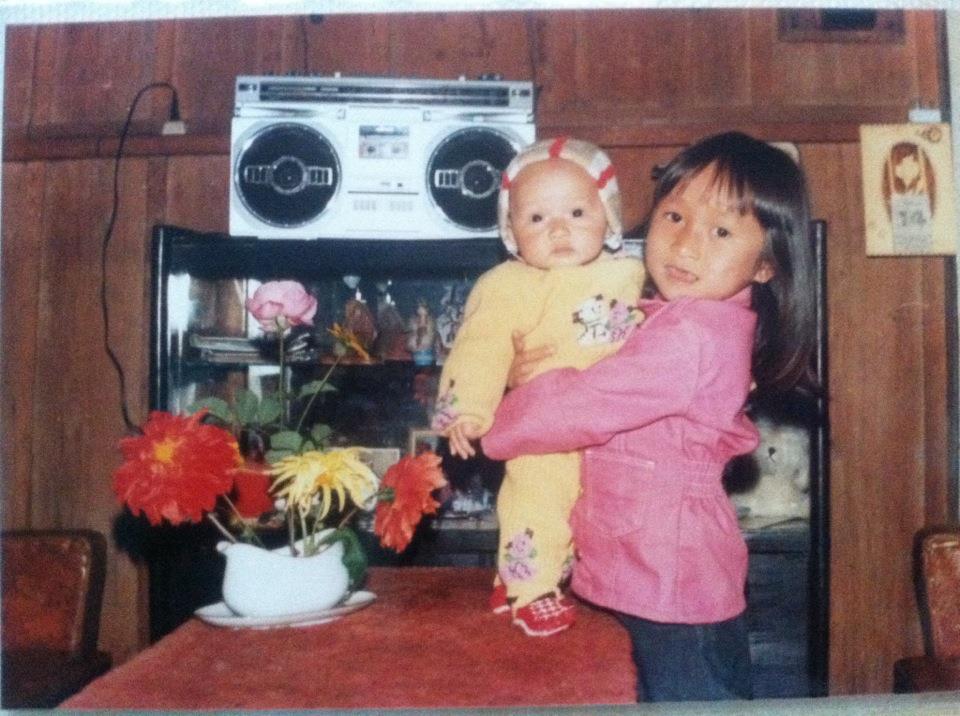 Diep Tran (left) and her sister Thao Tran, circa 1988 in Da Lat, Vietnam (note the '80s boom box in the background)