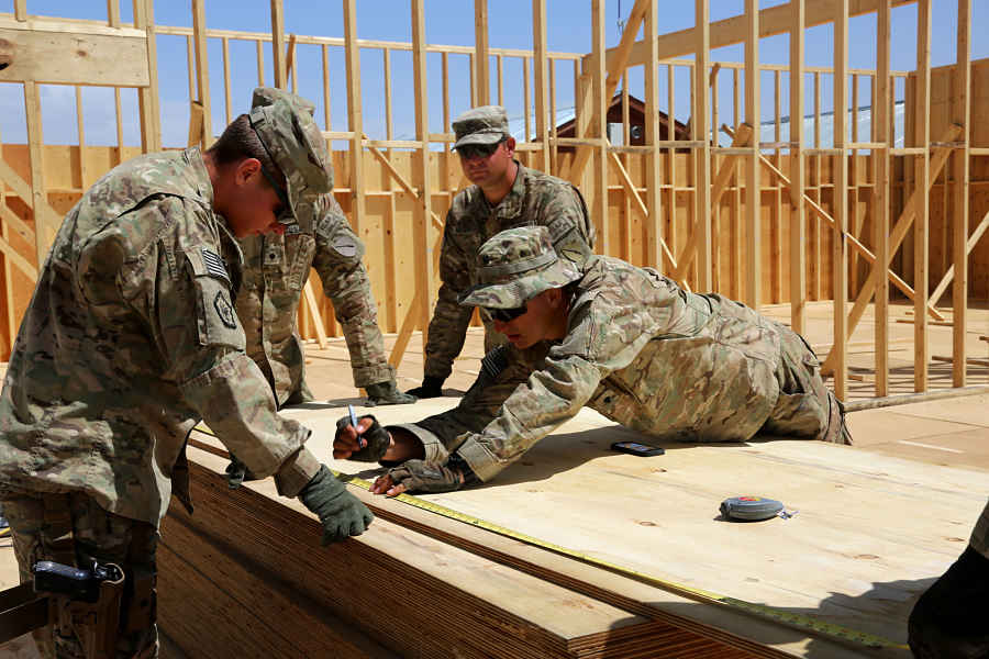U.S. Army Spc. Cody Hopper with the 149th Vertical Construction Company marks measurements on a piece of plywood at Forward Operating Base (FOB) Lightning, Paktiya province, Afghanistan, Aug. 19, 2013. (U.S. Army photo by Spc. Chenee' Brooks)