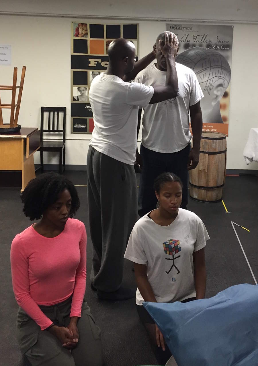 Tiffany Renee Johnson and Naïma Hebrail (kneeling), with Andrew Malone and Darren Jones (standing), in rehearsal for Pegasus Theatre's production of "Rutherford's Travels."