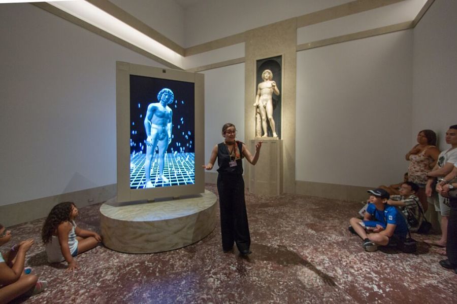 A docent explains the reconstruction of the Lombardo Adam at the Metropolitan Museum of Art. (Photo by Thomas B. Ling)